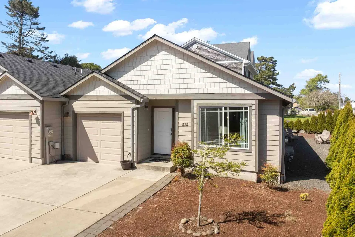 The home’s front door and landscaped garden, with a welcoming pathway leading to the entrance. The scene suggests a private, serene space where couples can unwind before heading out to explore the coast or enjoy quiet evenings outdoors.